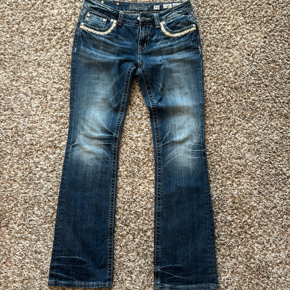 Women’s Miss Me Jeans.